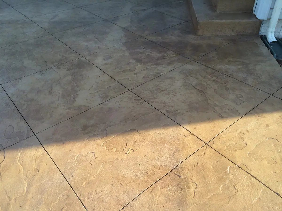 A tile floor with some shadows on it