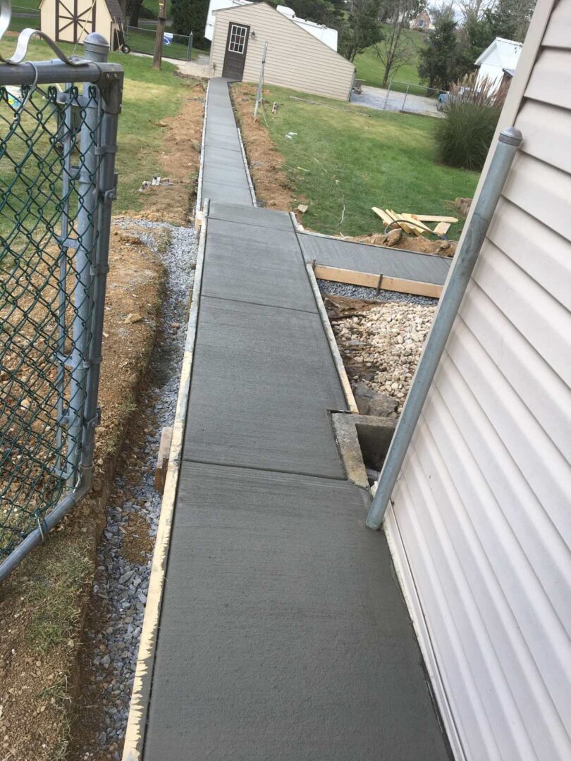 A walkway is shown with concrete on the side.