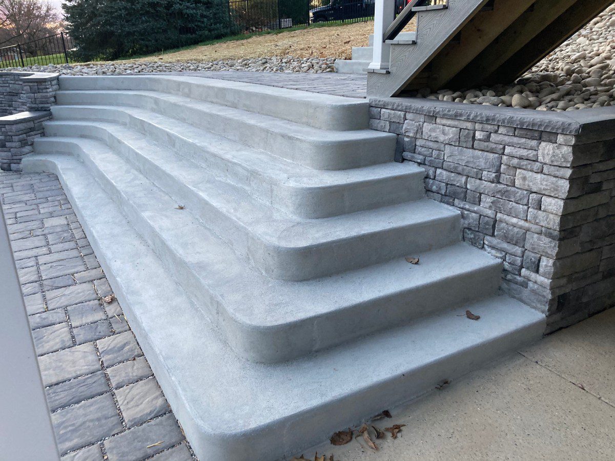 A set of steps leading up to the top of stairs.
