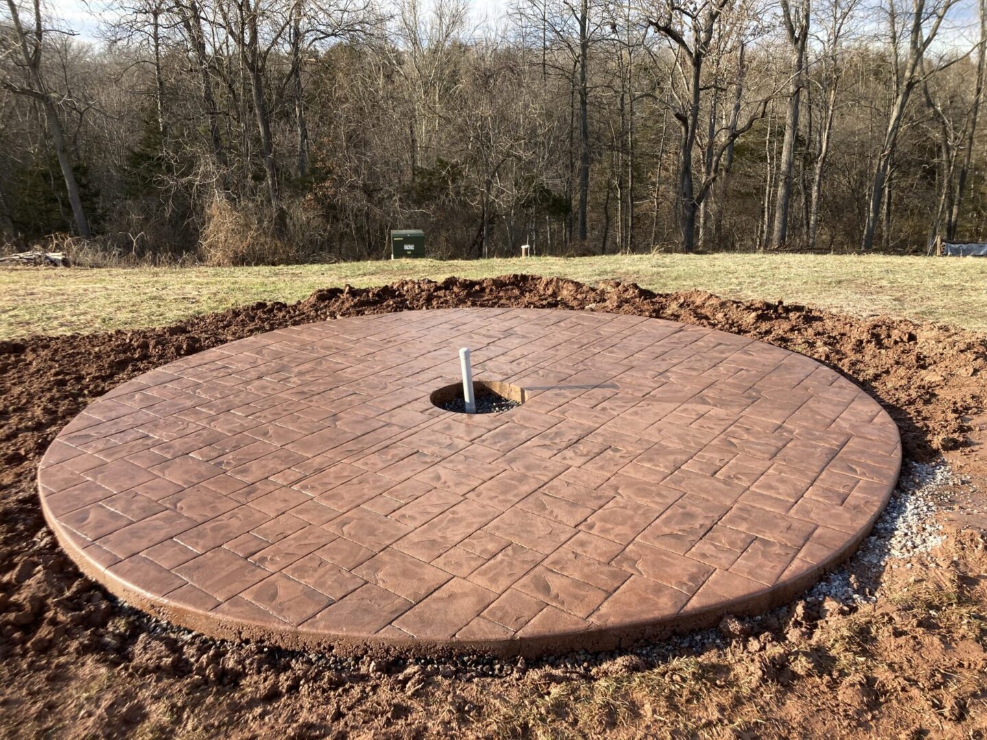A brick circle with a hole in it