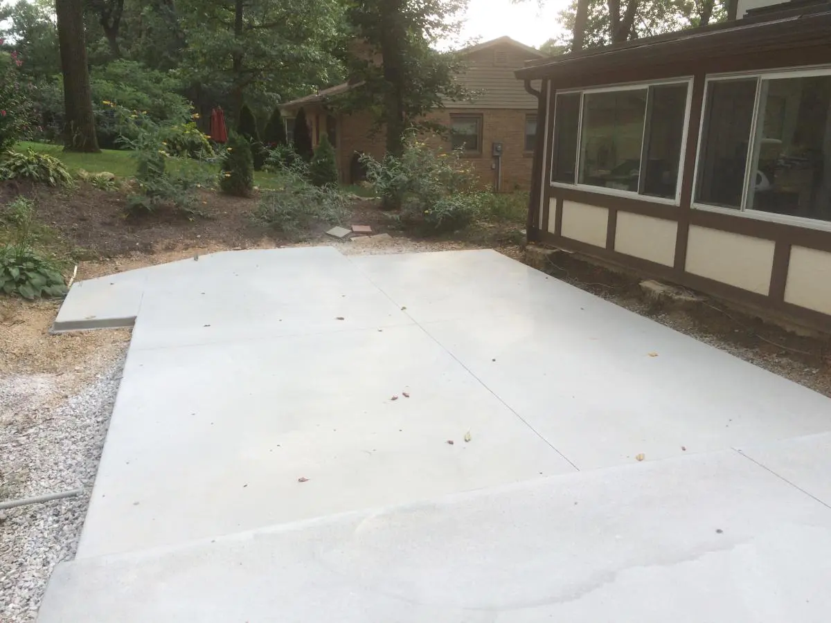 A white tarp covering the patio of a house.