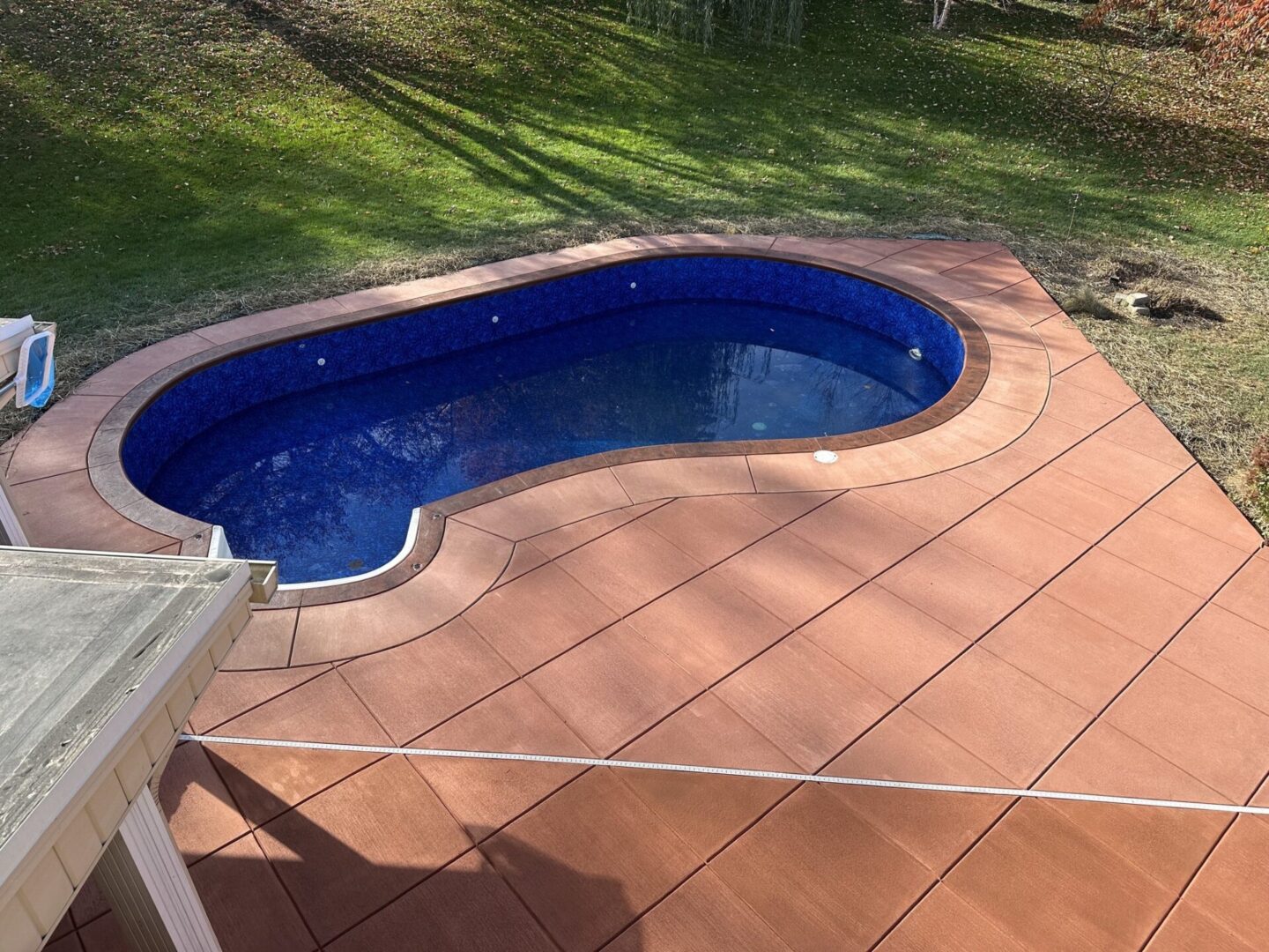 A pool that is in the shape of a heart.